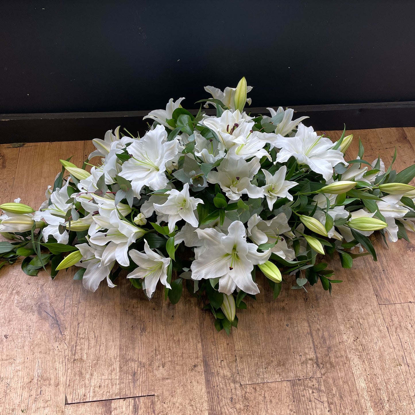 White lily casket spray