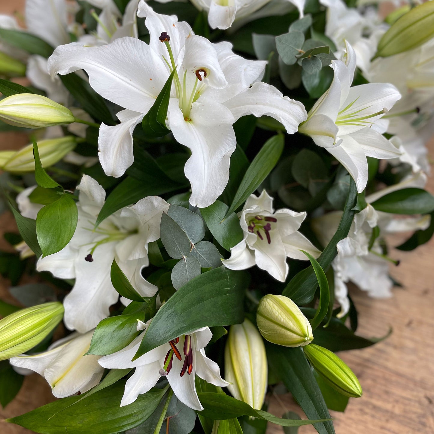 White lily casket spray